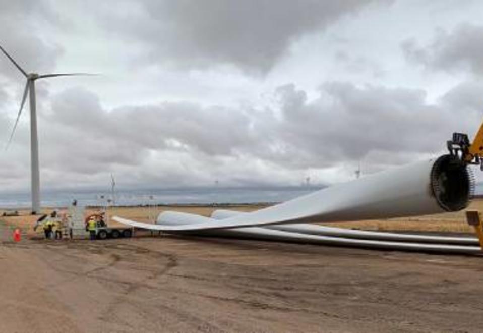 Wind turbine blades dismantled on the ground