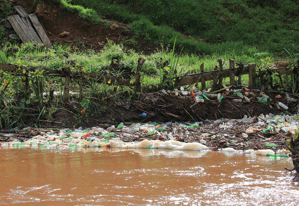 Pollution, plastic bottles in a river